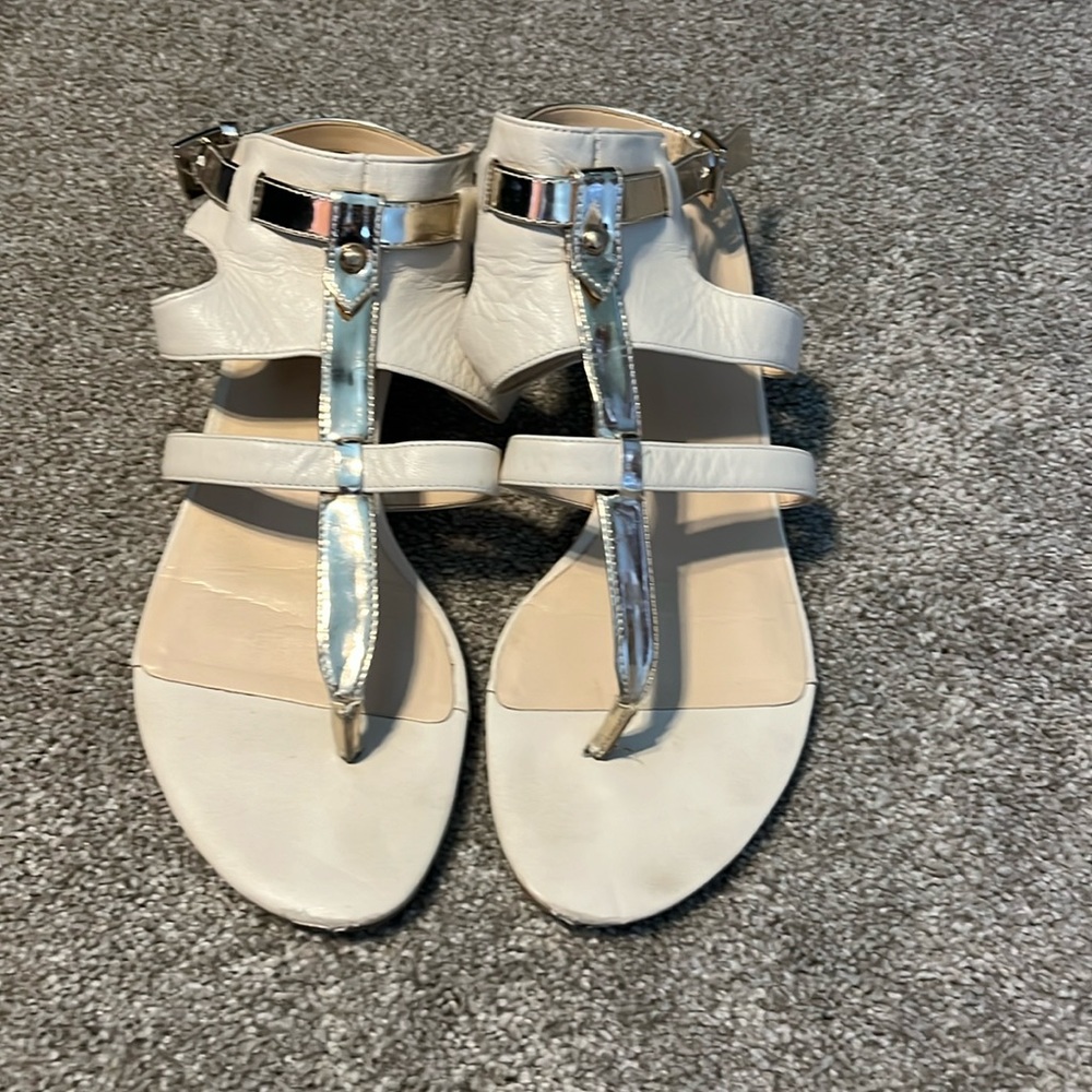 Nine West size 6.5 gladiator sandals in white leather with gold.